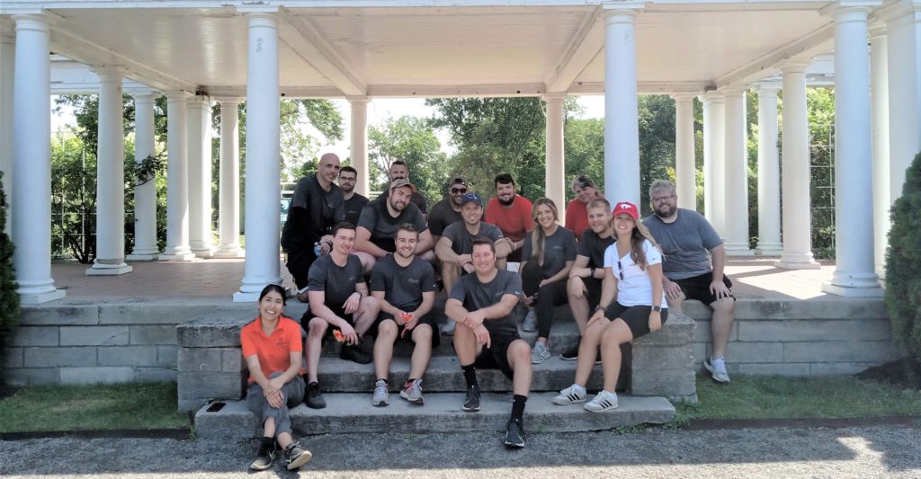 Team under pergola at the rose garden