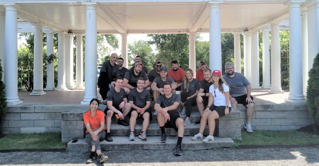 Team under pergola at the rose garden