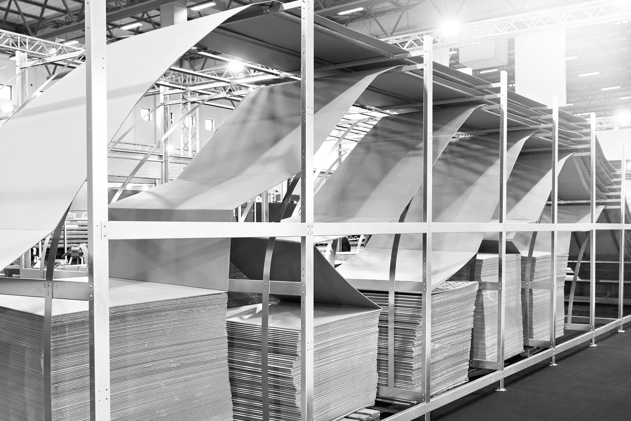 SEO service for packaging companies illustrated by corrugated cardboard box making machine